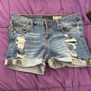 Torn and tattered jeans shorts for summer fun!